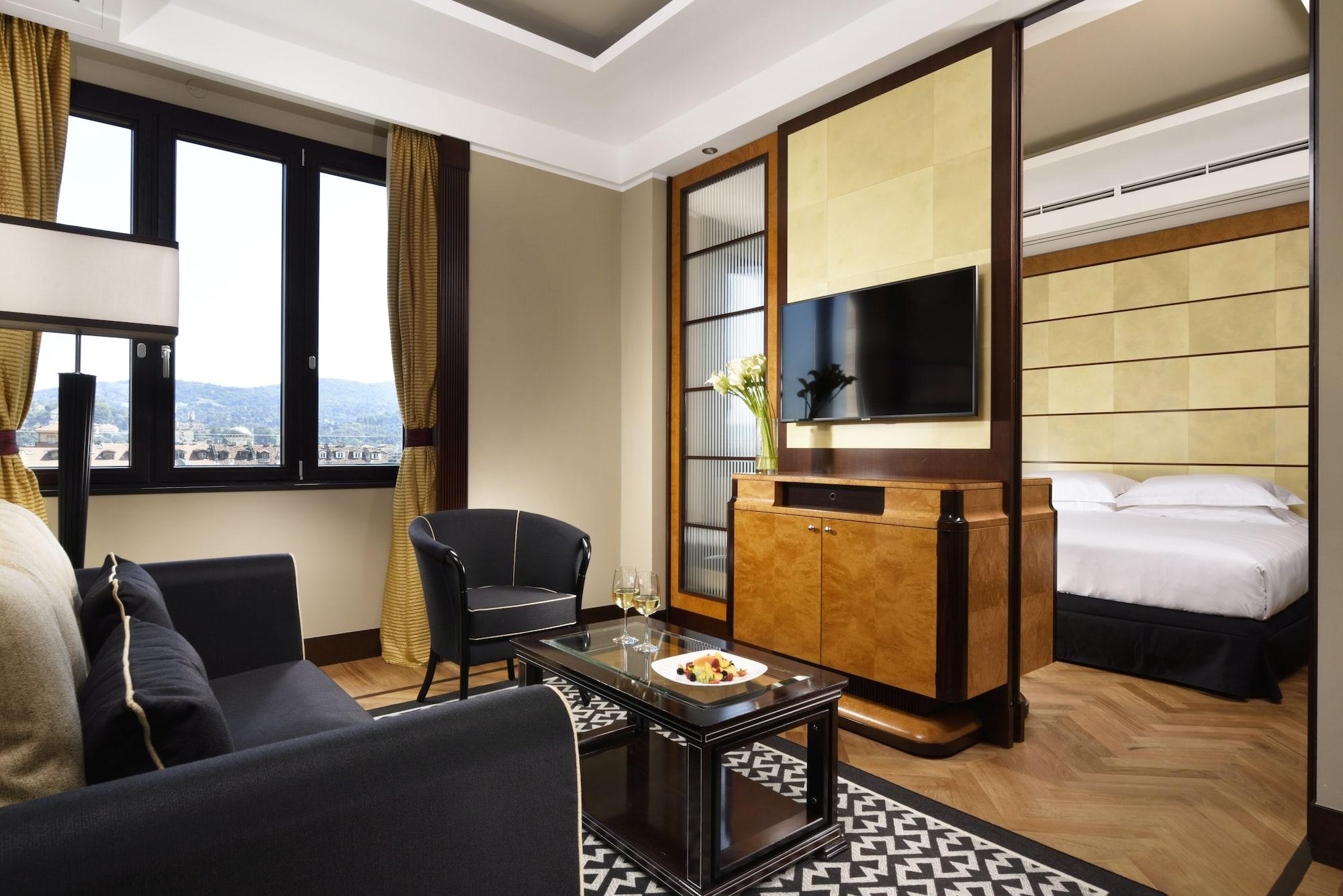 فندق برينسيبي دي بيمونتي - أونا إسبيرينزي تورينو المظهر الخارجي الصورة A suite at the hotel